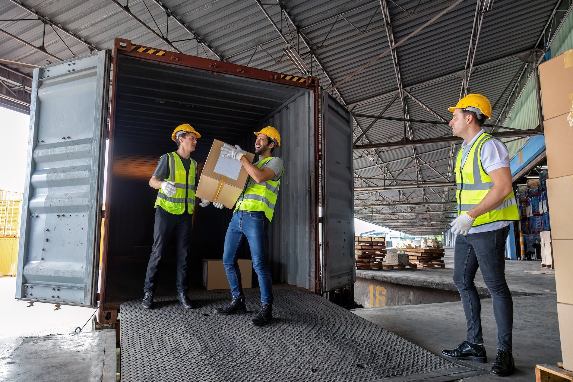 worker-carry-carton-box-taken-from-40-feet-steel-c-2024-10-18-06-41-32-utc